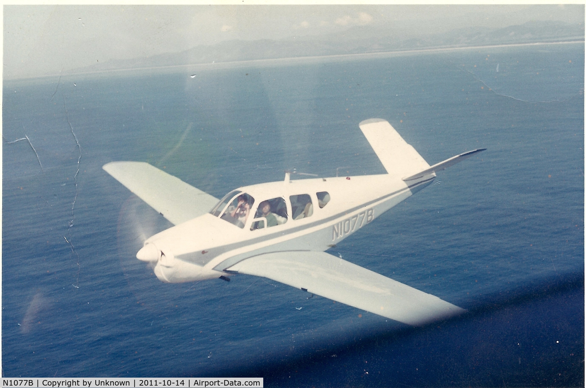 N1077B, 1957 Beech H35 Bonanza C/N D-4931, Flying off the coast of Santa Barbara in the early 1960's with my father (Ken St.Oegger) at the controls.