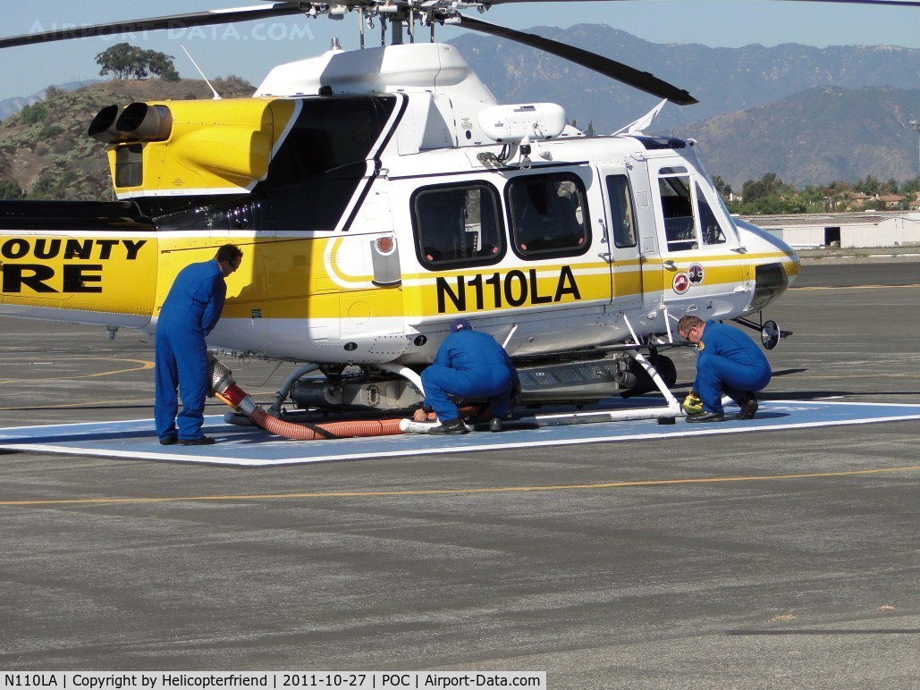 N110LA, 2005 Bell 412EP C/N 36392, After re-fueling, Crew assembles the Kawak Industries auxiliary hydraulic power system  snorkel