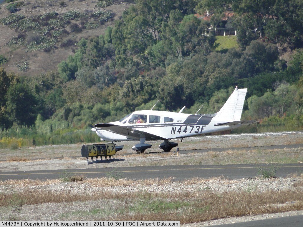N4473F, 1976 Piper PA-28-151 C/N 28-7715035, Waiting permission to taxi onto taxiway Sierra at taxiway Delta