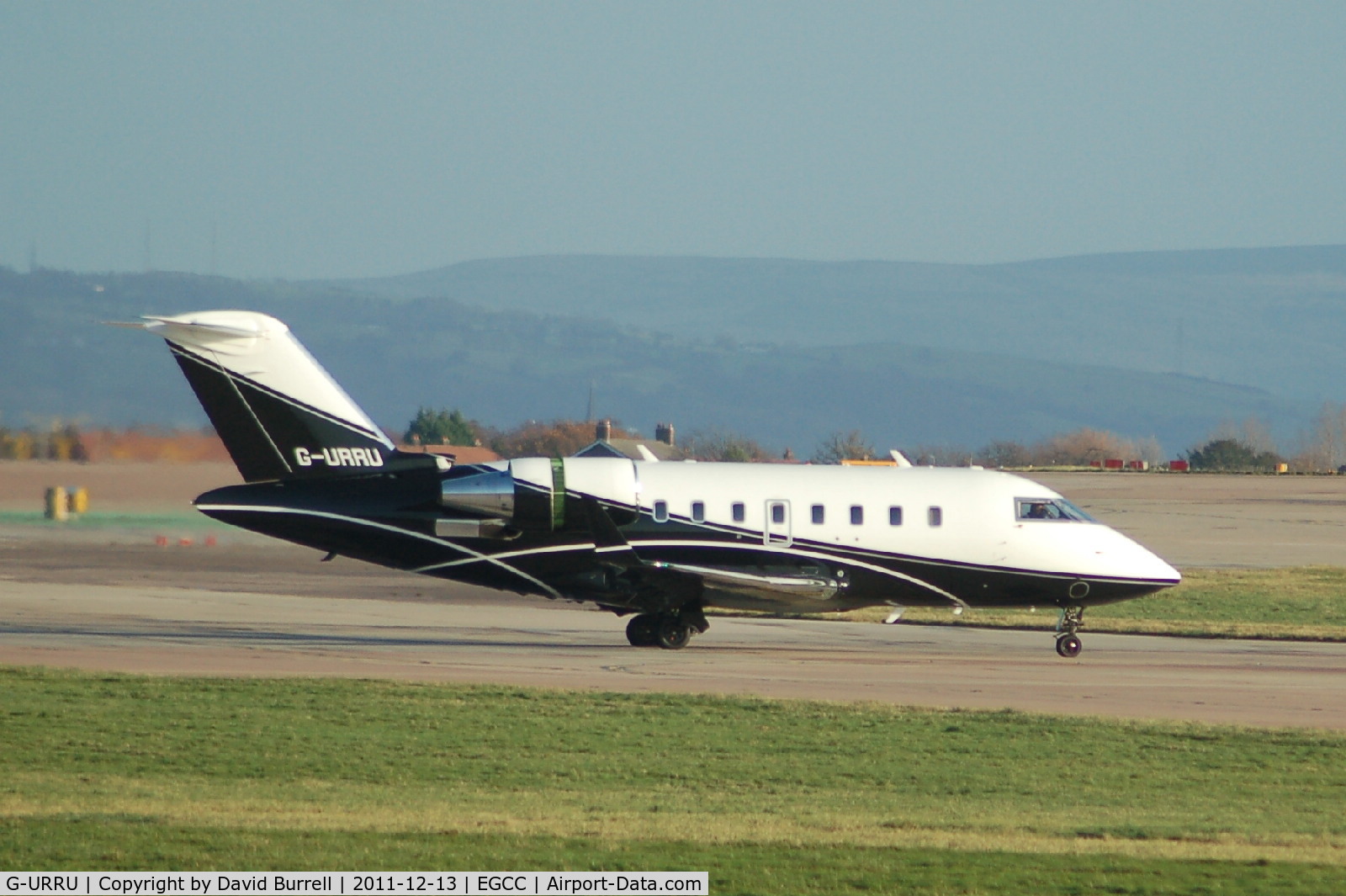 G-URRU, 2009 Bombardier Challenger 605 (CL-600-2B16) C/N 5821, Bombardier Cl-600-2b16 taxiing Manchester Airport.