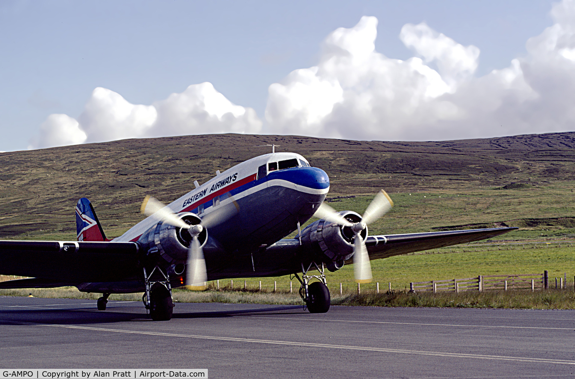 G-AMPO, 1944 Douglas DC-3C-R-1830-90C (C-47B) C/N 33186, In Eastern Airways livery taxies to terminal early 1980s