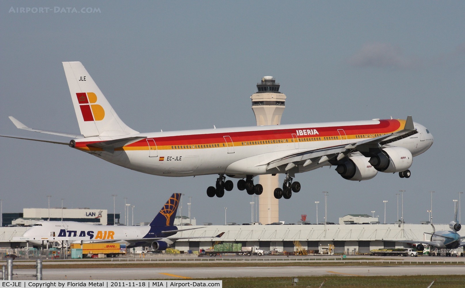 EC-JLE, 2005 Airbus A340-642 C/N 702, Iberia with the tower and the 16 ft shorter 747-400 in the background.