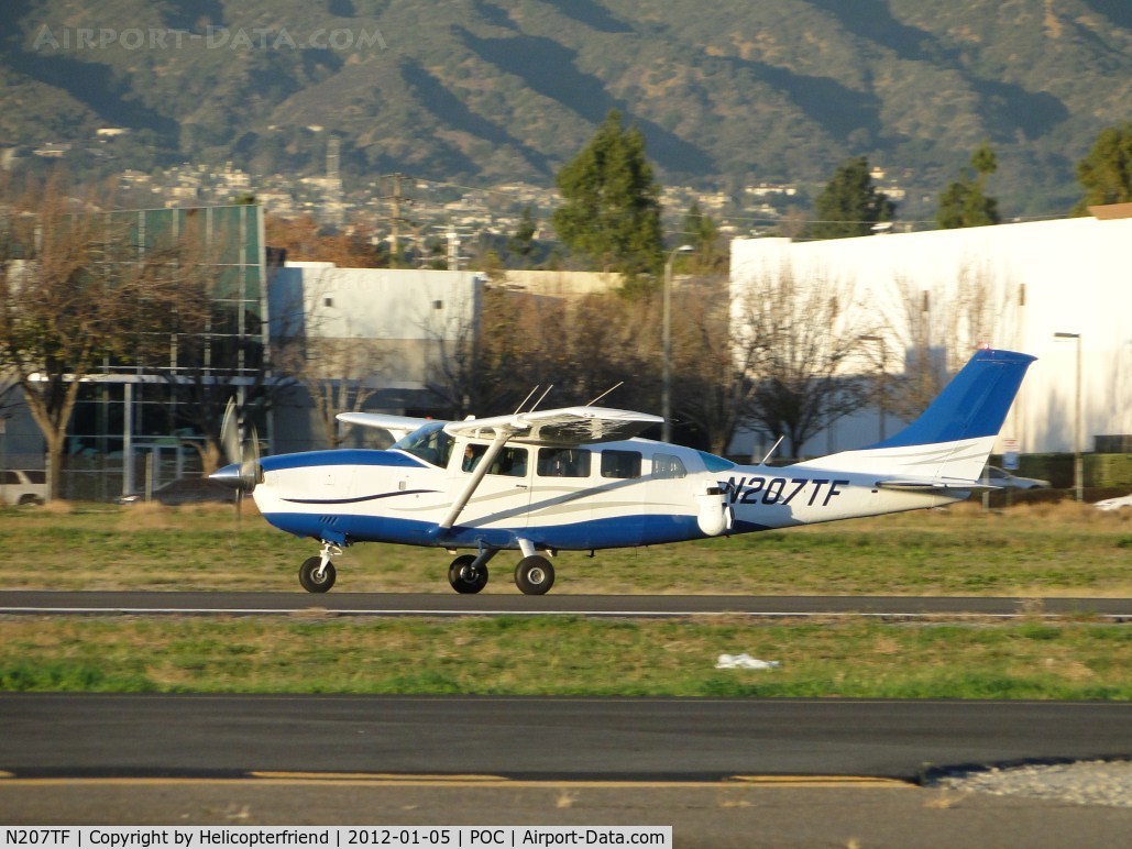 N207TF, 1987 Cessna T207A C/N 20700492, Taking off on runway 26L after dropping off passengers at Howard Aviation