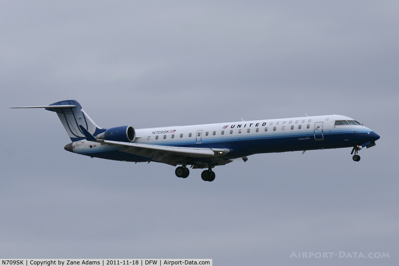 N709SK, 2004 Bombardier CRJ-701ER (CL-600-2C10) Regional Jet C/N 10159, United Express at DFW Airport