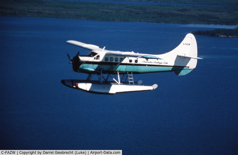 C-FAZW, 1966 De Havilland Canada DHC-3 Otter Otter C/N 451, AZW over Wollaston Lake, SK, in the early 1980 aprox. (poor slide scan!)