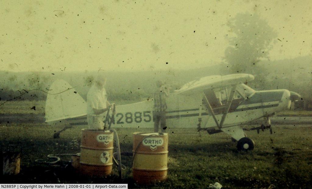 N2885P, 1954 Piper PA-18A 150 Super Cub C/N 18-4482, Bud Confer loading chemicals into N2885P in New Paltz NY in 1969