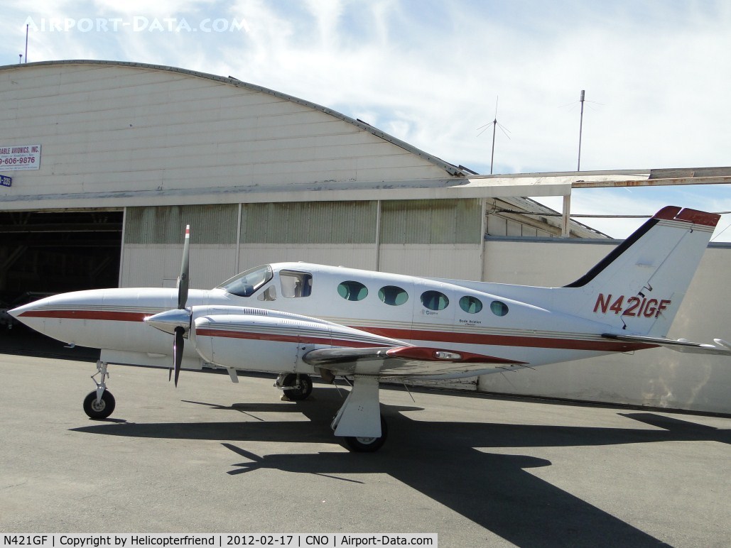 N421GF, Cessna 421C Golden Eagle C/N 421C1110, Parked by a hanger