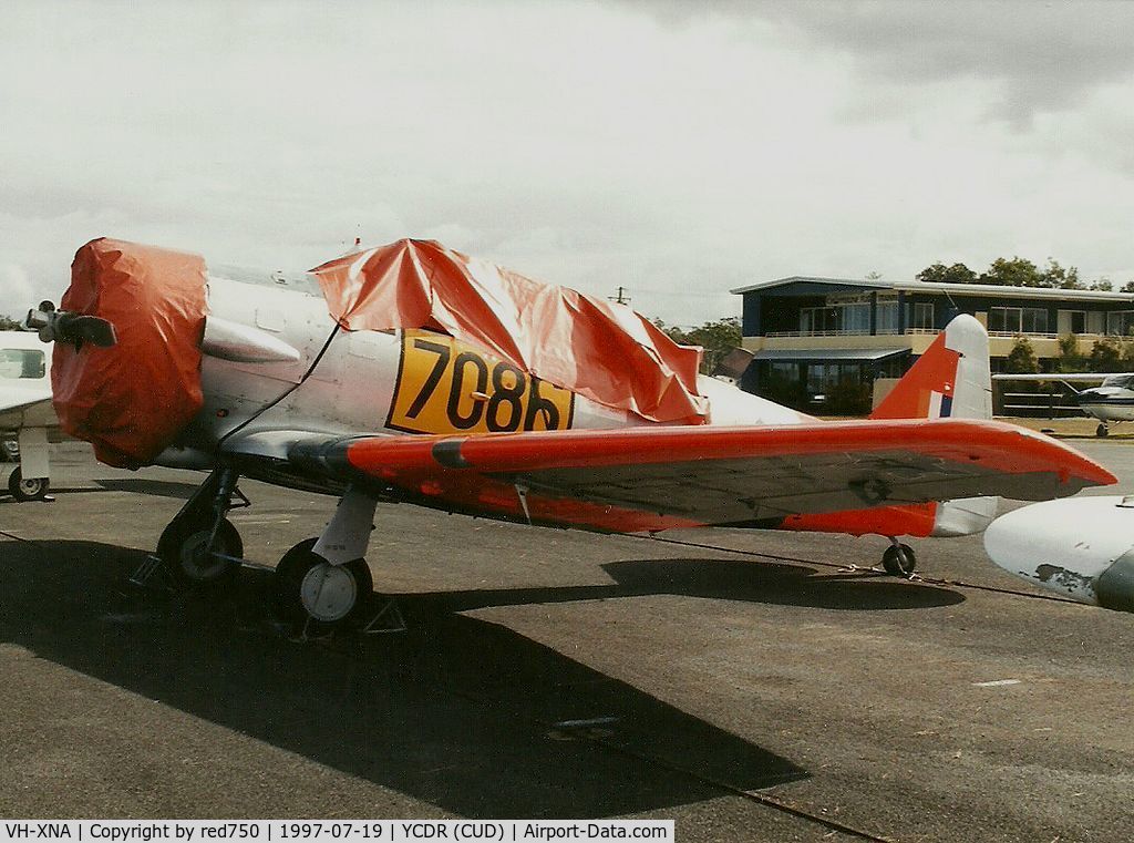 VH-XNA, 1942 North American AT-6C Harvard IIA C/N 88-9754, Photograph by Edwin van Opstal with permission. Scanned from a color print. Photograhed at Caloundra, Qld (CUD)