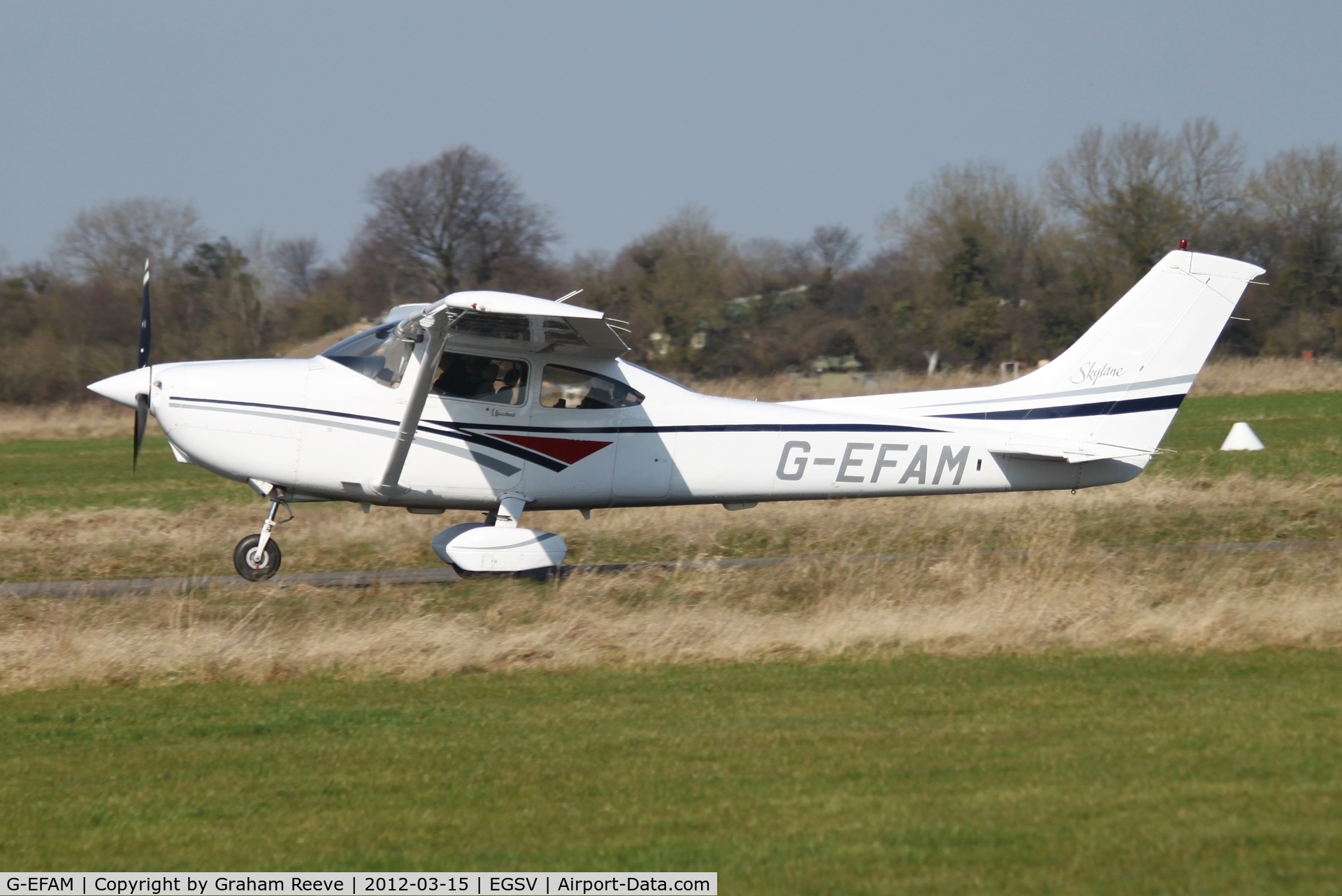 G-EFAM, 1999 Cessna 182S Skylane C/N 18280442, Taking off.