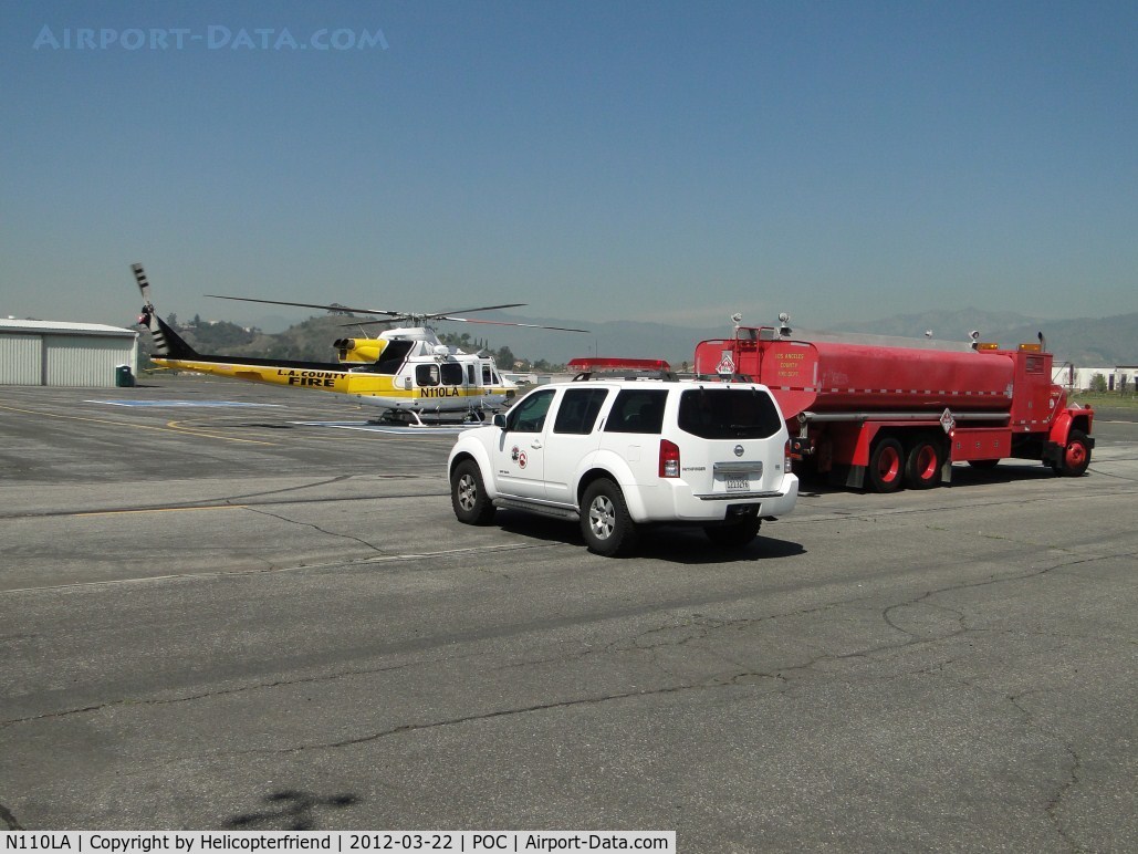 N110LA, 2005 Bell 412EP C/N 36392, Crewman drives up, Copter 11 starts up and off they go westbound