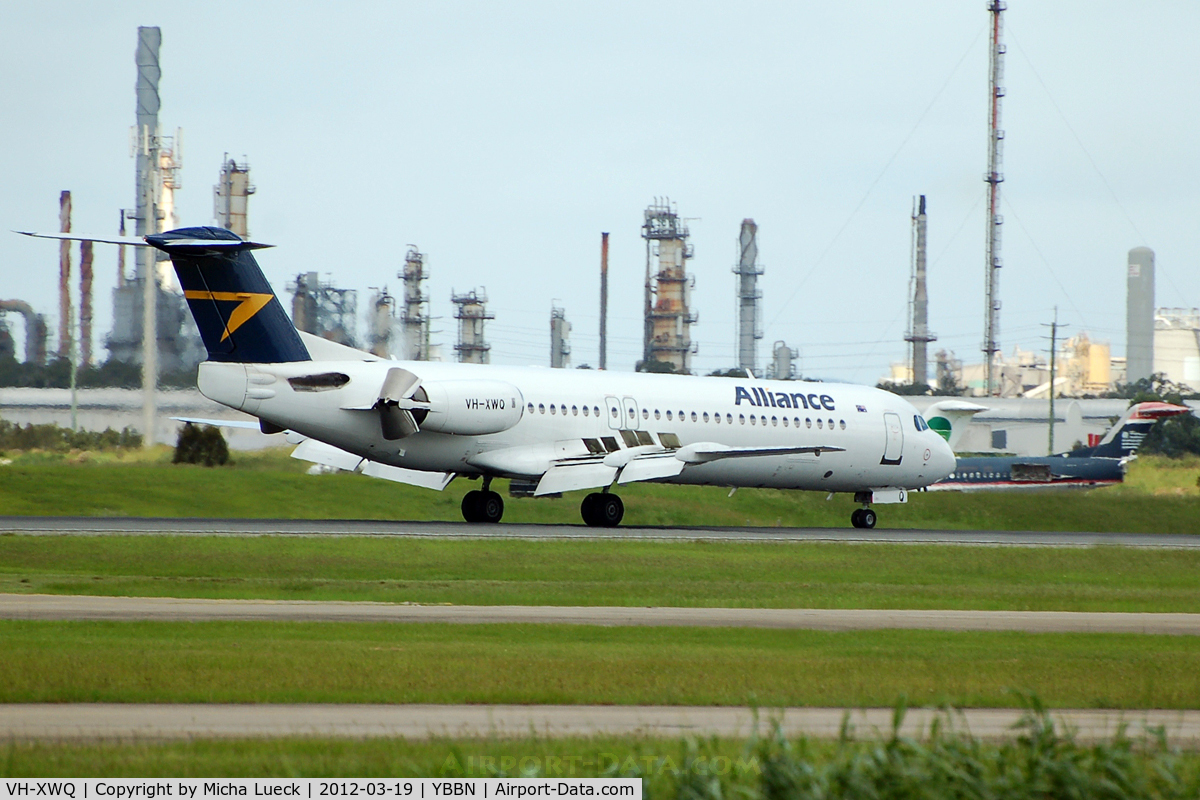VH-XWQ, 1990 Fokker 100 (F-28-0100) C/N 11300, 2 F100s of Germania and US Airways in the background