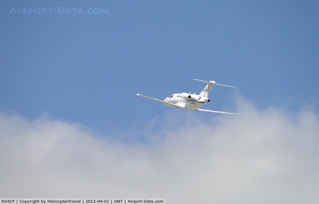 N54CF, 2009 Cessna 510 Citation Mustang Citation Mustang C/N 510-0253, Departing 26L and heading towards the clouds