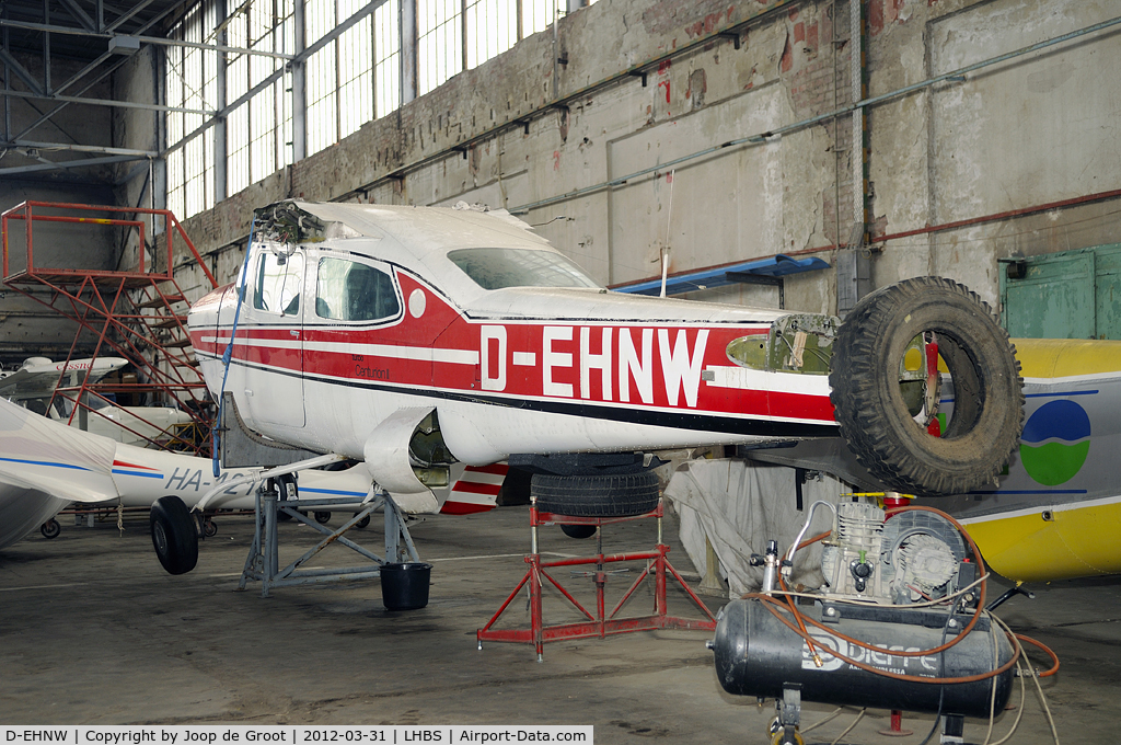D-EHNW, Cessna T210L Turbo Turbo Centurion C/N 21060771, Was involved in a landing accident on July the 11th 2011. The remains of the aircraft are now stored in the back of the hangar.