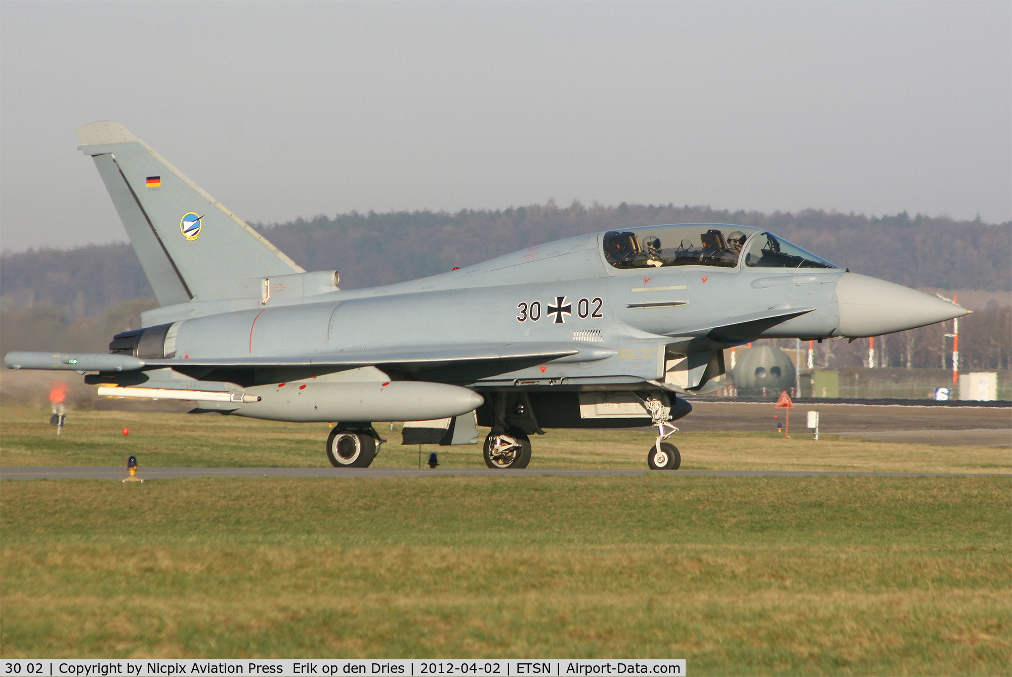 30 02, Eurofighter EF-2000 Typhoon T C/N 009/GT002, German AF Eurofighter 3002 on its' way to enter the runway at Neuburg AB, Germany