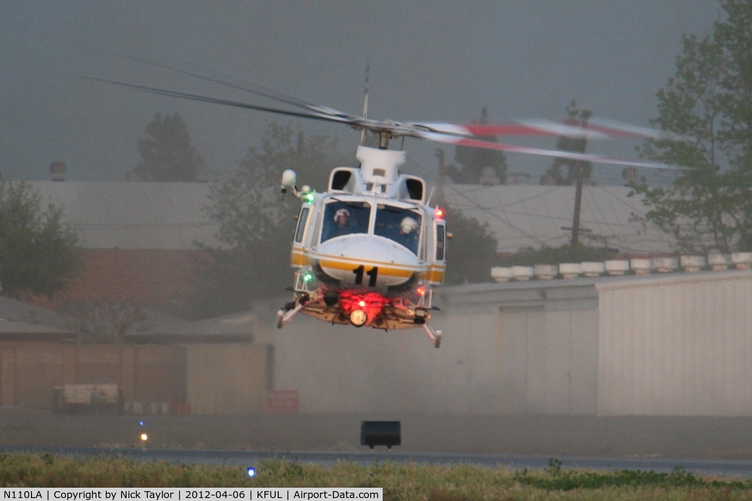 N110LA, 2005 Bell 412EP C/N 36392, Stirring up some dirt while departing