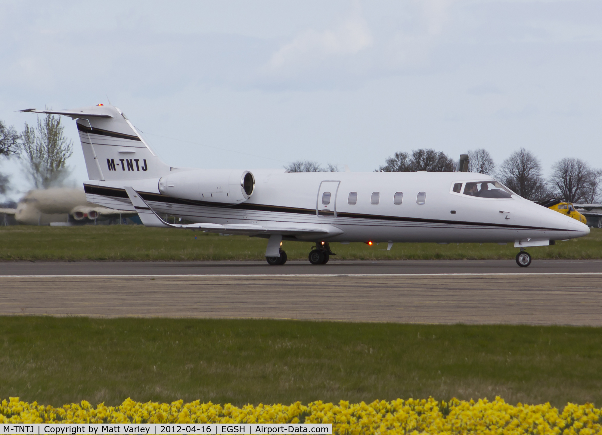 M-TNTJ, 1983 Learjet 55 C/N 55-087, Departing EGSH after ferrying the crew of OO-TAZ.(ZE708)