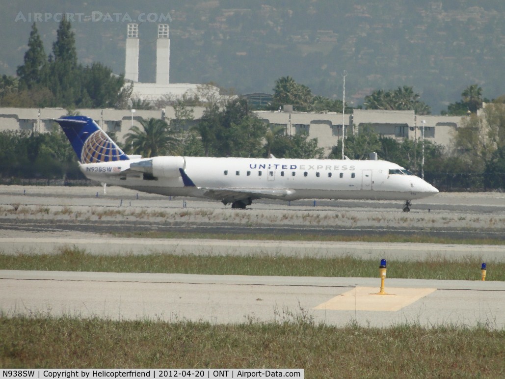 N938SW, 2003 Bombardier CRJ-200LR (CL-600-2B19) C/N 7741, Taxiing back on taxiway November after landing on 26R