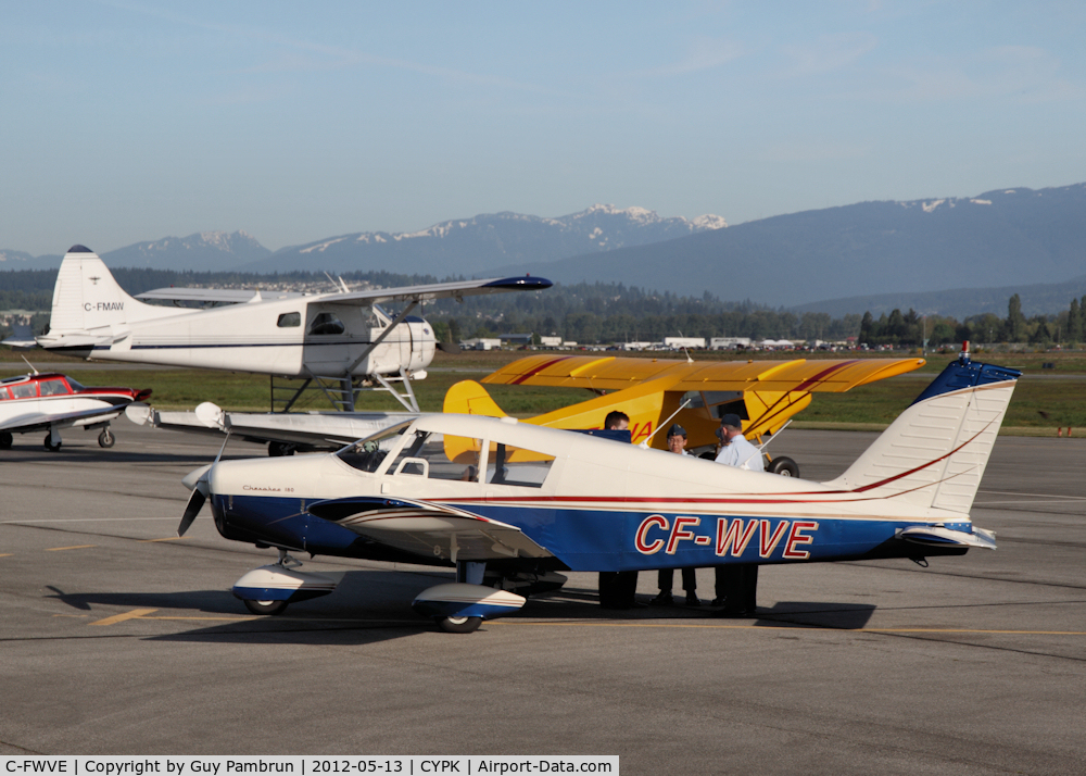 C-FWVE, 1964 Piper PA-28-180 C/N 28-1691, Air Cadets taking part in the pre flight inspection.