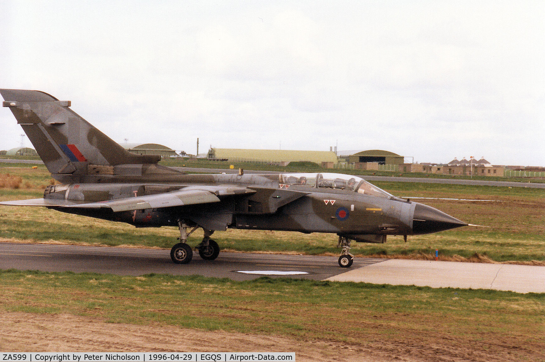 ZA599, 1982 Panavia Tornado GR.1 C/N 120/BT025/3063, Tornado GR.1 of 12 Squadron taxying to Runway 05 at RAF Lossiemouth in April 1996 and wearing traces of the previous unit markings of the Tri-National Tornado Training Establishment on the fin.