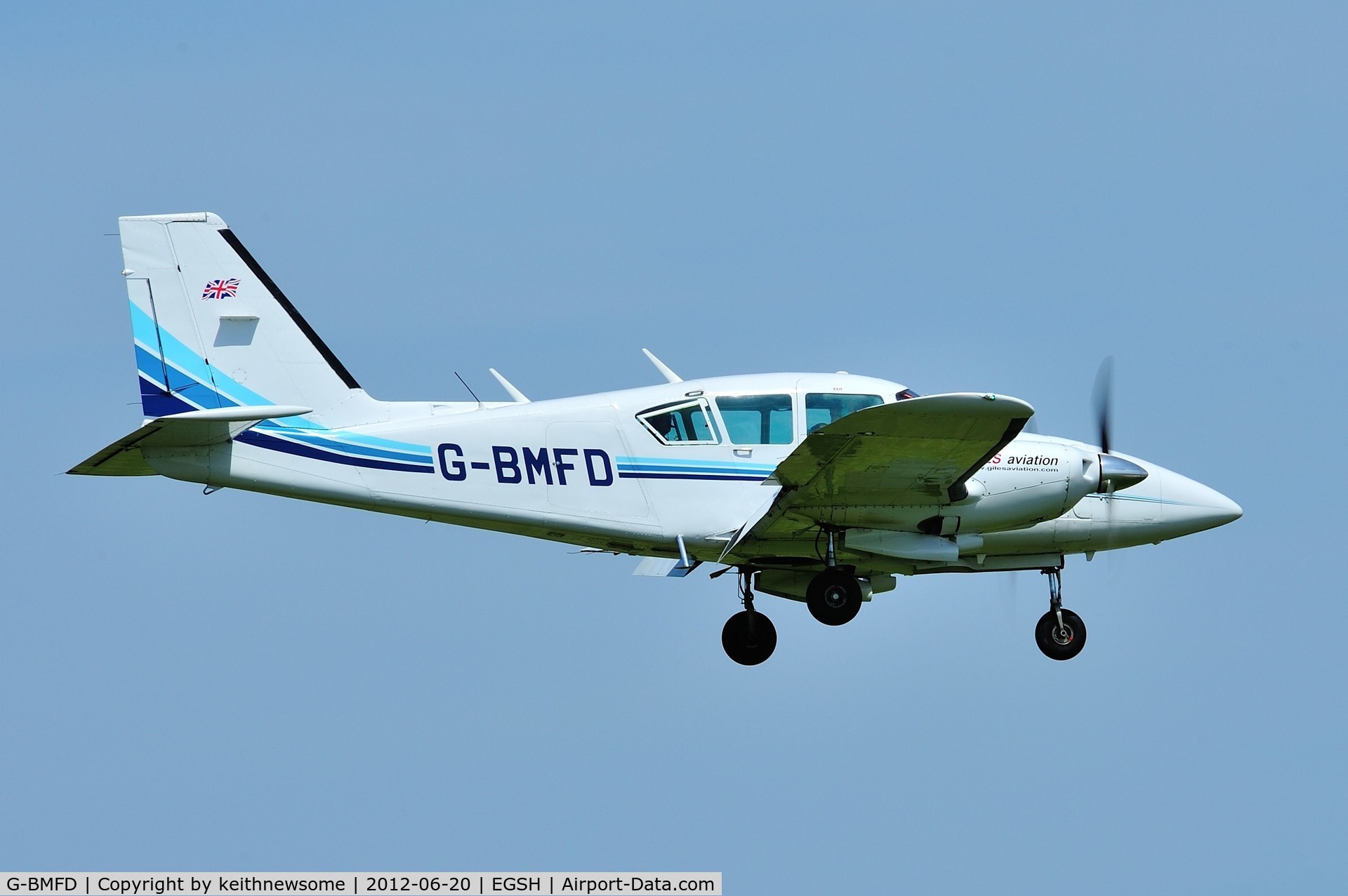 G-BMFD, 1979 Piper PA-23-250 Aztec F C/N 27-7954080, Landing onto 09 with the sun above !