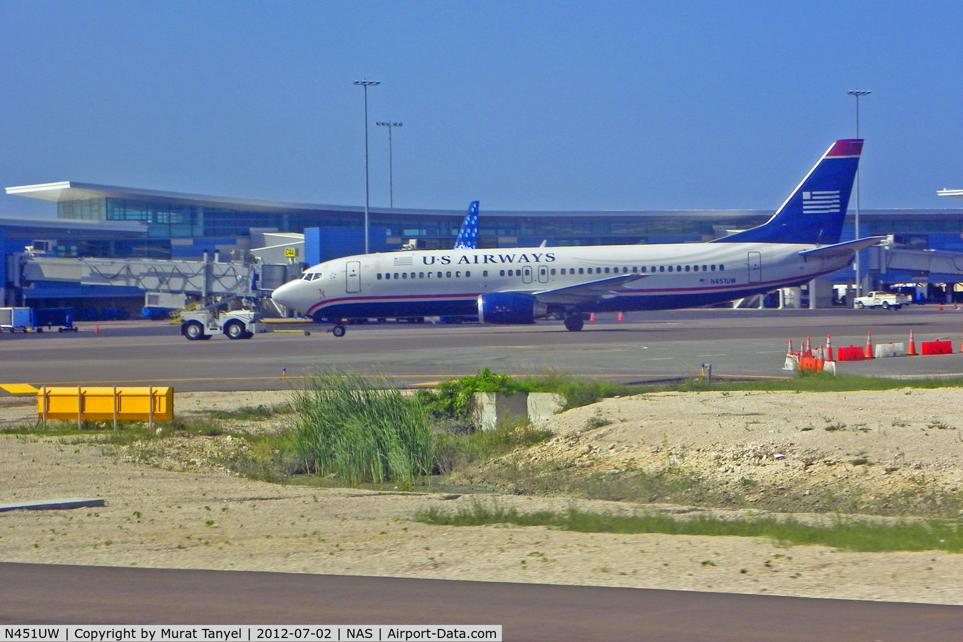 N451UW, 1990 Boeing 737-4B7 C/N 24934, Being pushed back at Nassau Intl