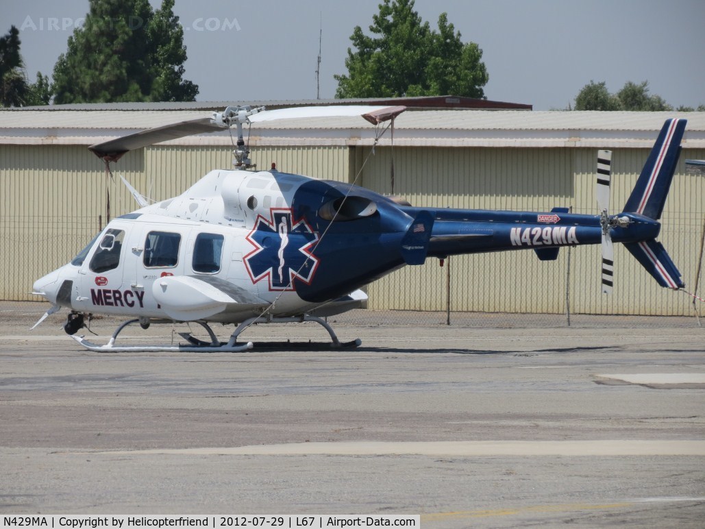 N429MA, 1984 Bell 222UT C/N 47523, Parked in Mercy Air parking area with 2 other Bell 222