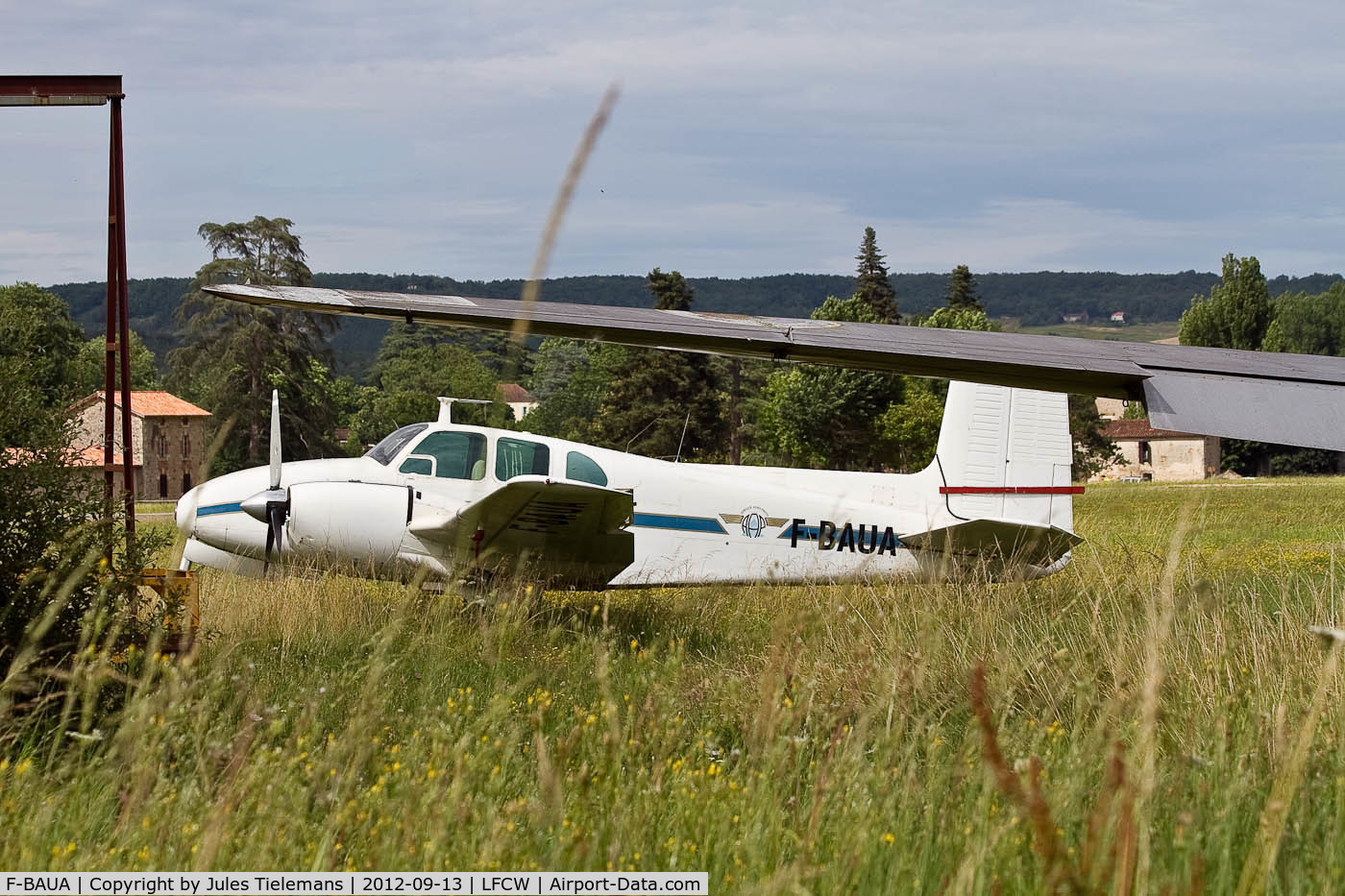 F-BAUA, 1956 Beech D50 Twin Bonanza C/N DH-39, Airplane seen in France on the arfield of Villeneuve-sur-Lot. Starboard engine missing.