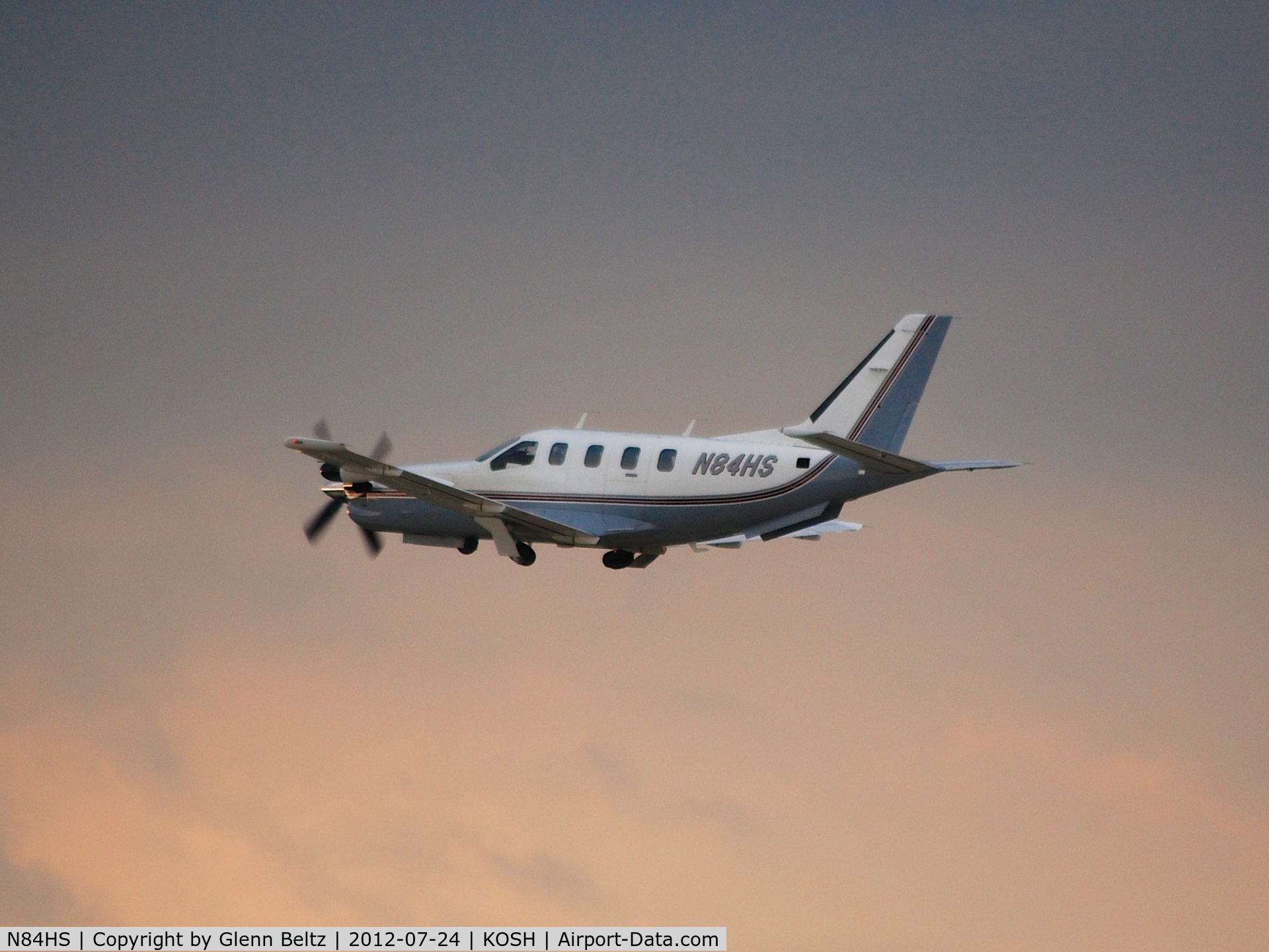 N84HS, Socata TBM-700 C/N 50, Departing EAA Airventure/Oshkosh on 24 July 2012.