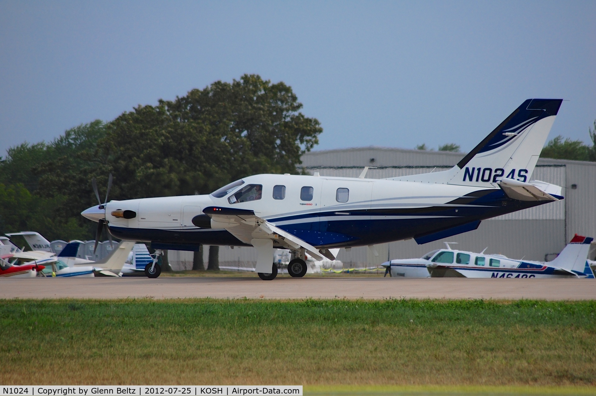 N1024, 1960 Cessna 210 C/N 57425, Taxiing at Oshkosh on 25 July 2012.