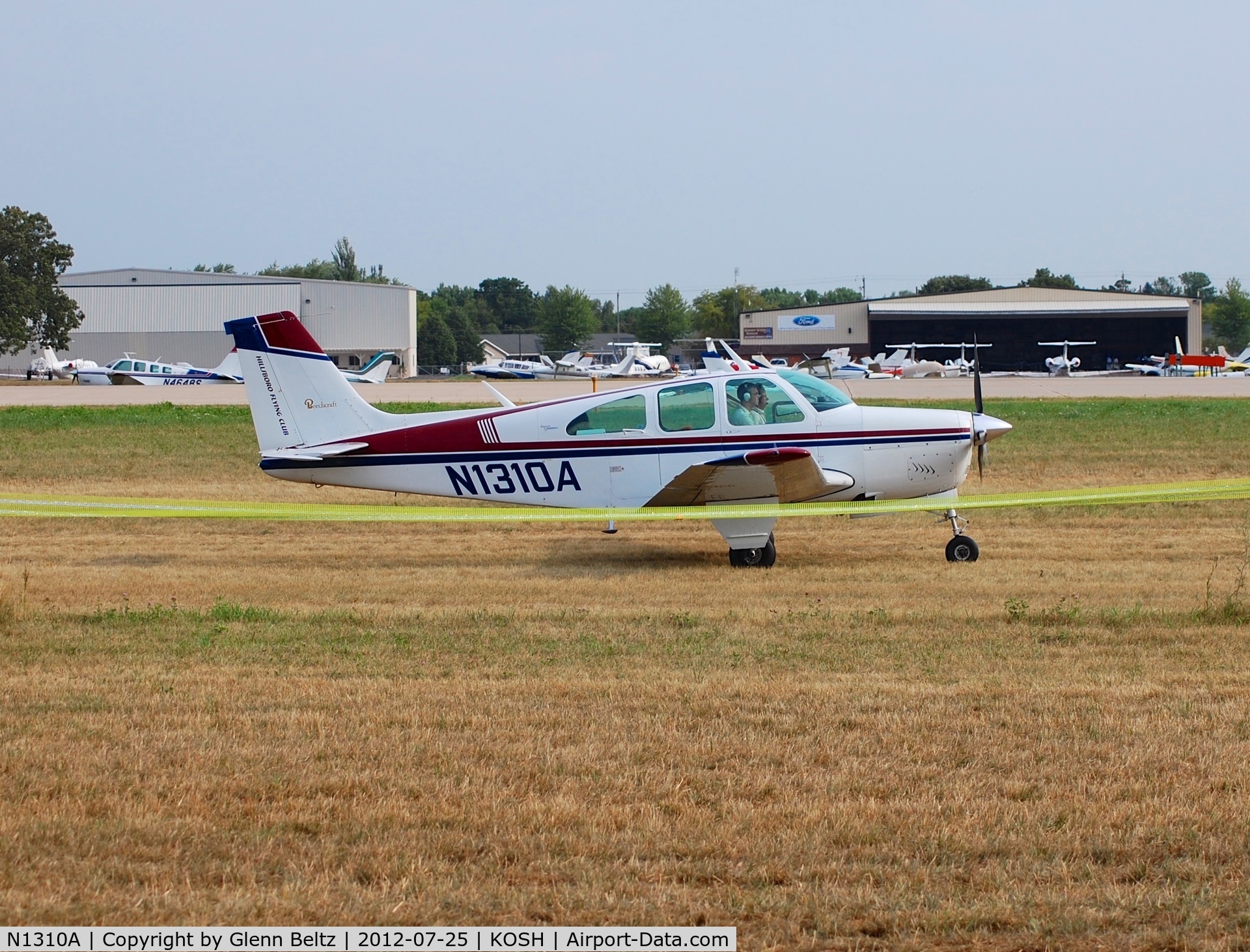 N1310A, 1967 Beech 35-C33 Debonair C/N CD-1105, Taxiing at Oshkosh on 25 July 2012.