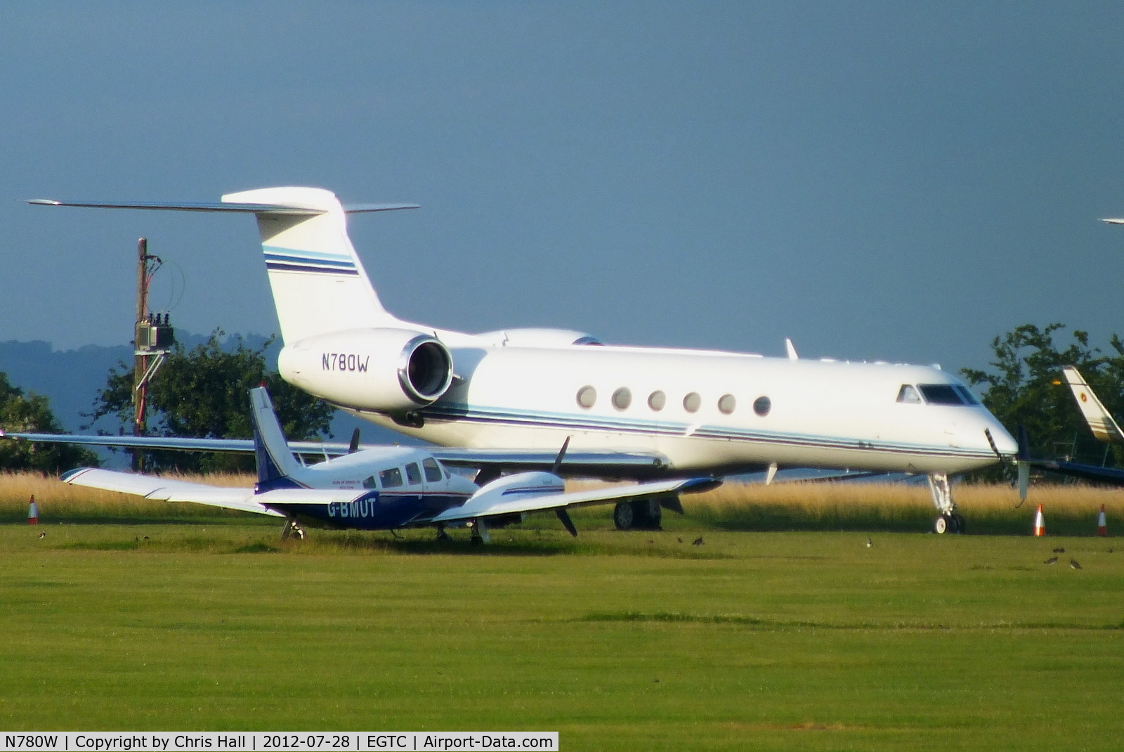 N780W, 1997 Gulfstream Aerospace G-V C/N 530, one of several bizjets parked at Cranfield with visitors for the opening of the London 2012 Olympic games