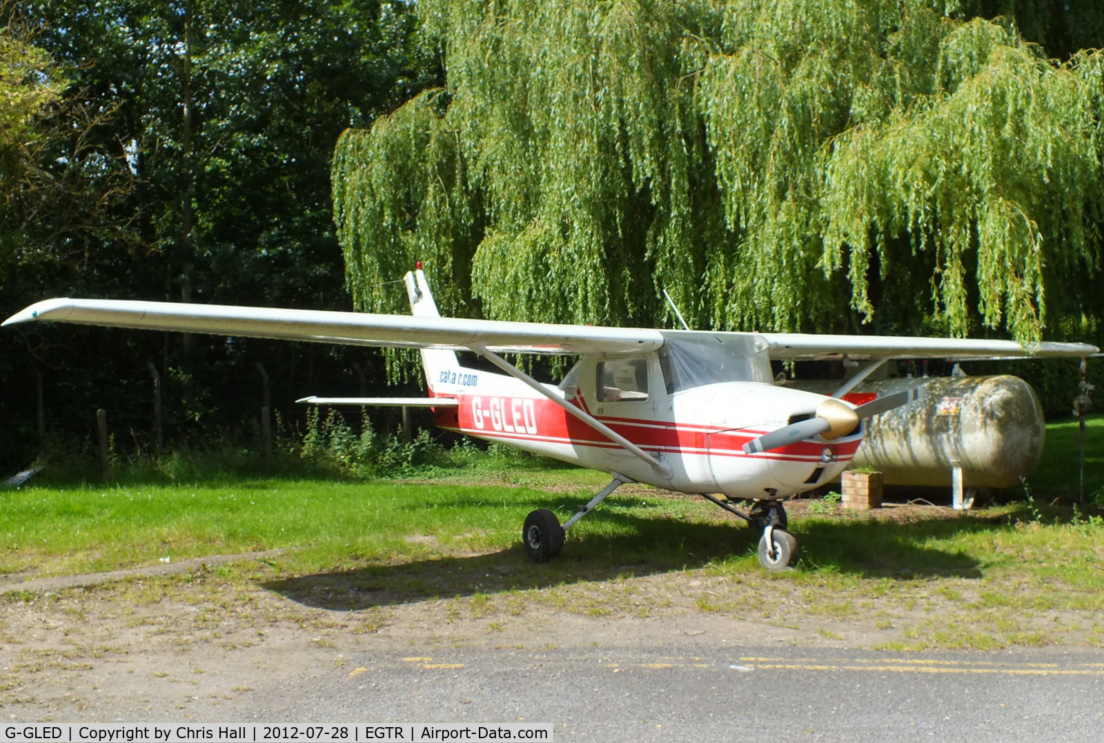 G-GLED, 1975 Cessna 150M C/N 150-76673, parked at the airfield entrance with a For Sale sign in the window