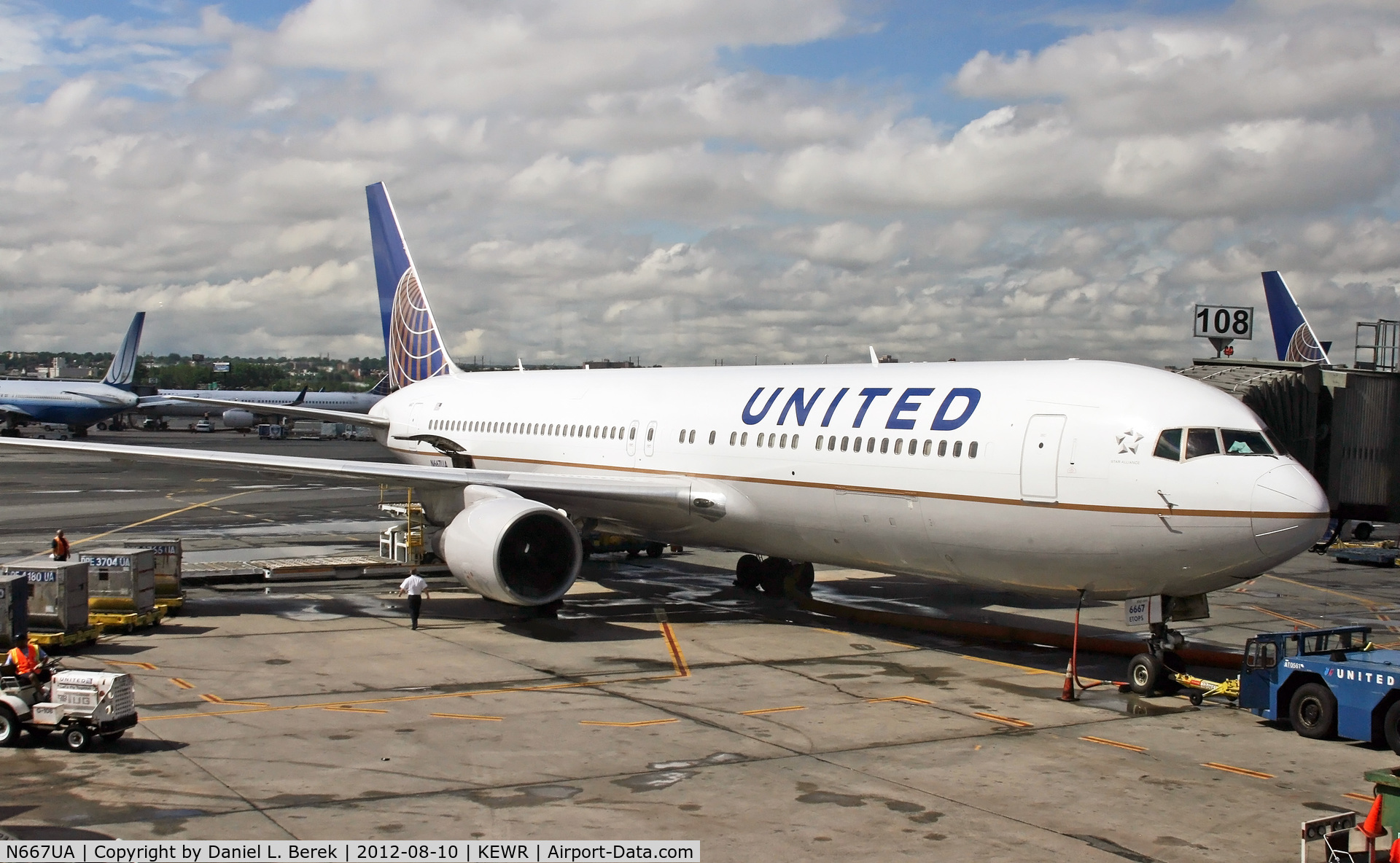 N667UA, 1998 Boeing 767-322 C/N 29239, A newly repainted UA 767-322/ER awaits its next journey on a stormy day at Newark.