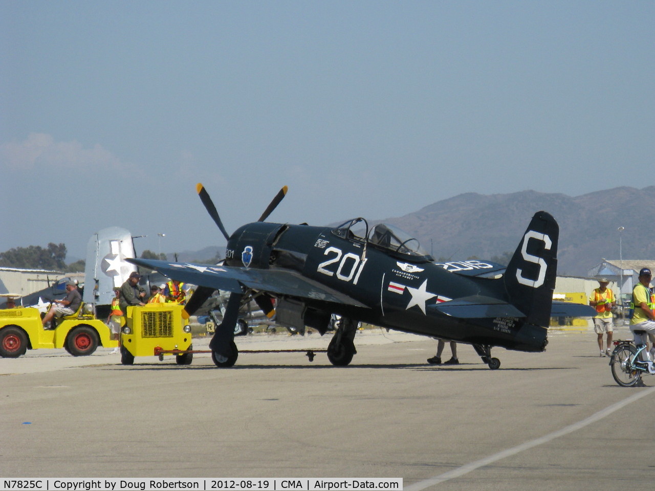 N7825C, 1948 Grumman F8F-2 (G58) Bearcat C/N D.1227, 1949 Grumman F8F-2 BEARCAT, P&W R-2800-34W 2,100 Hp, in tow on flight line. Aircraft is a 1949, not 1948 as registered.