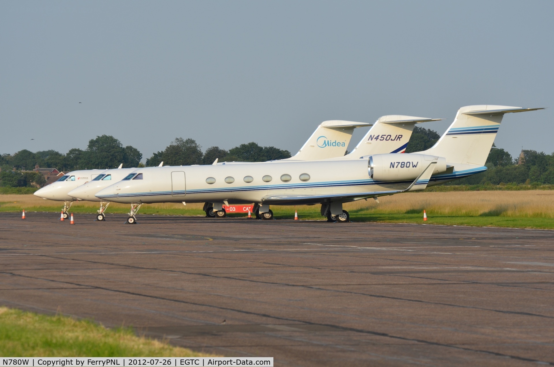 N780W, 1997 Gulfstream Aerospace G-V C/N 530, A few of the aircraft parked at Cranfield . These aircraft came from Luton and were ferried to Cranfield due to capacity reasons because of the Olympics 2012 opening ceremony next day.