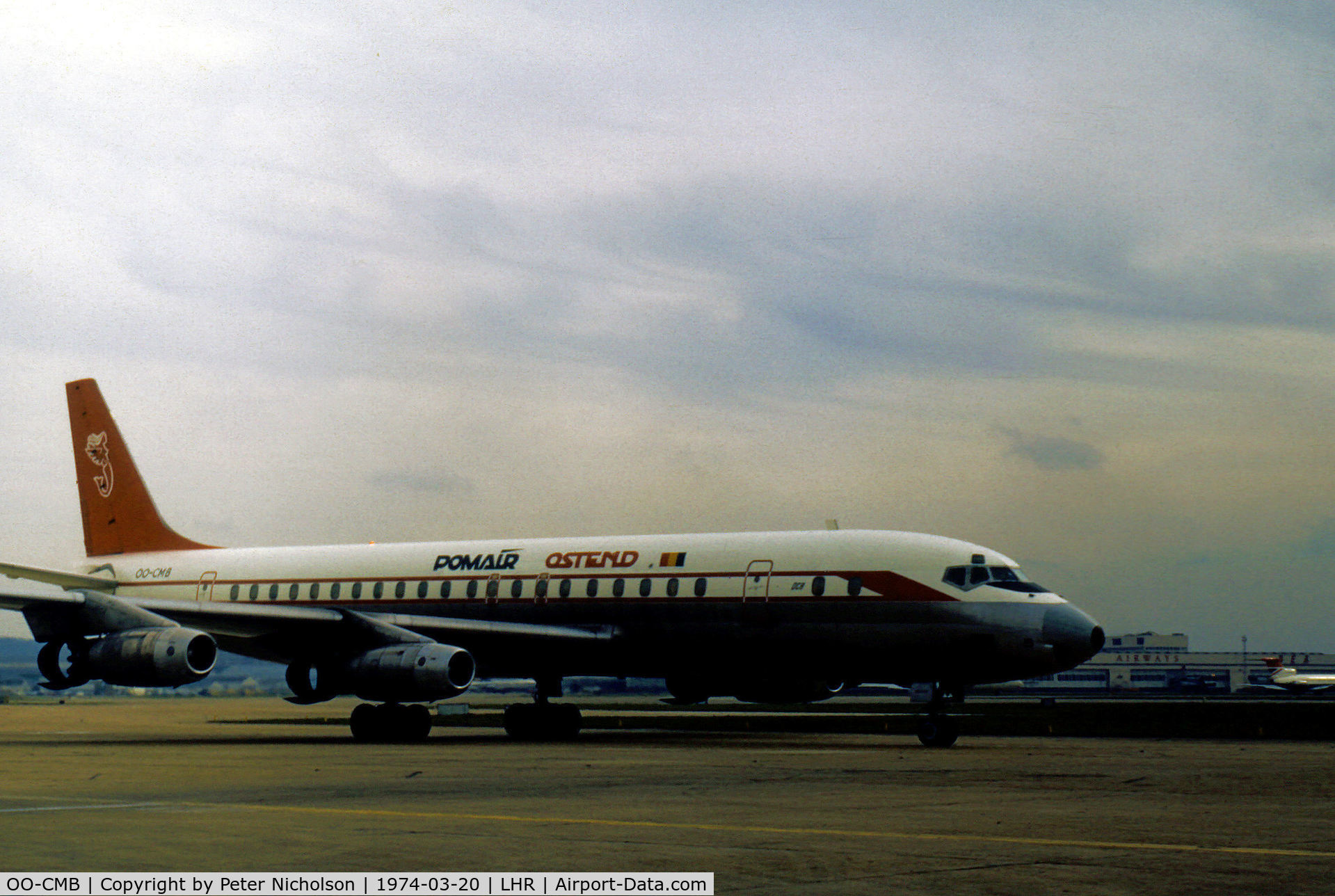 OO-CMB, 1960 Douglas DC-8-32 C/N 45382, DC-8-32 of Pomair taxying to the active runway at London Heathrow in March 1974.