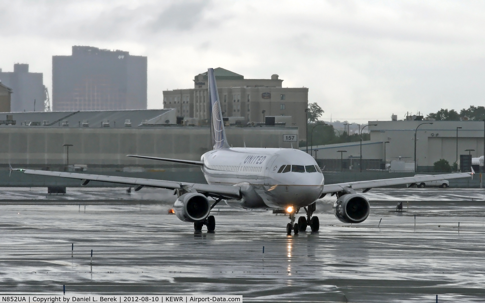 N852UA, 2002 Airbus A319-131 C/N 1671, A United Airbus A319 taxies in at a very wet Newark International, having weathered severe rainstorms.
