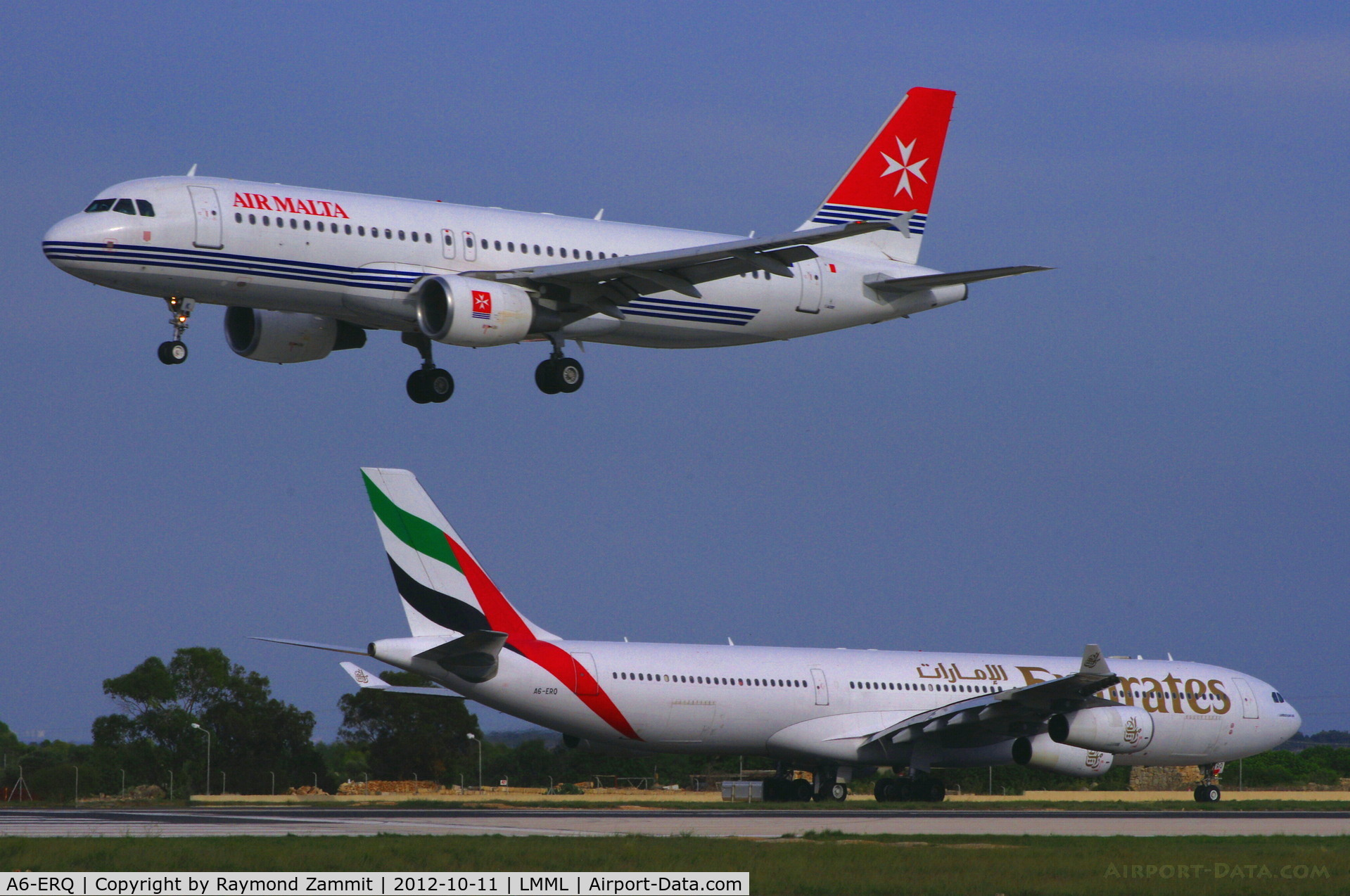A6-ERQ, 1997 Airbus A340-313X C/N 190, A340 A6-ERQ of Emirates Airlines waiting to line up RW31 behind the landing Airmalta A320 9H-AEK.
