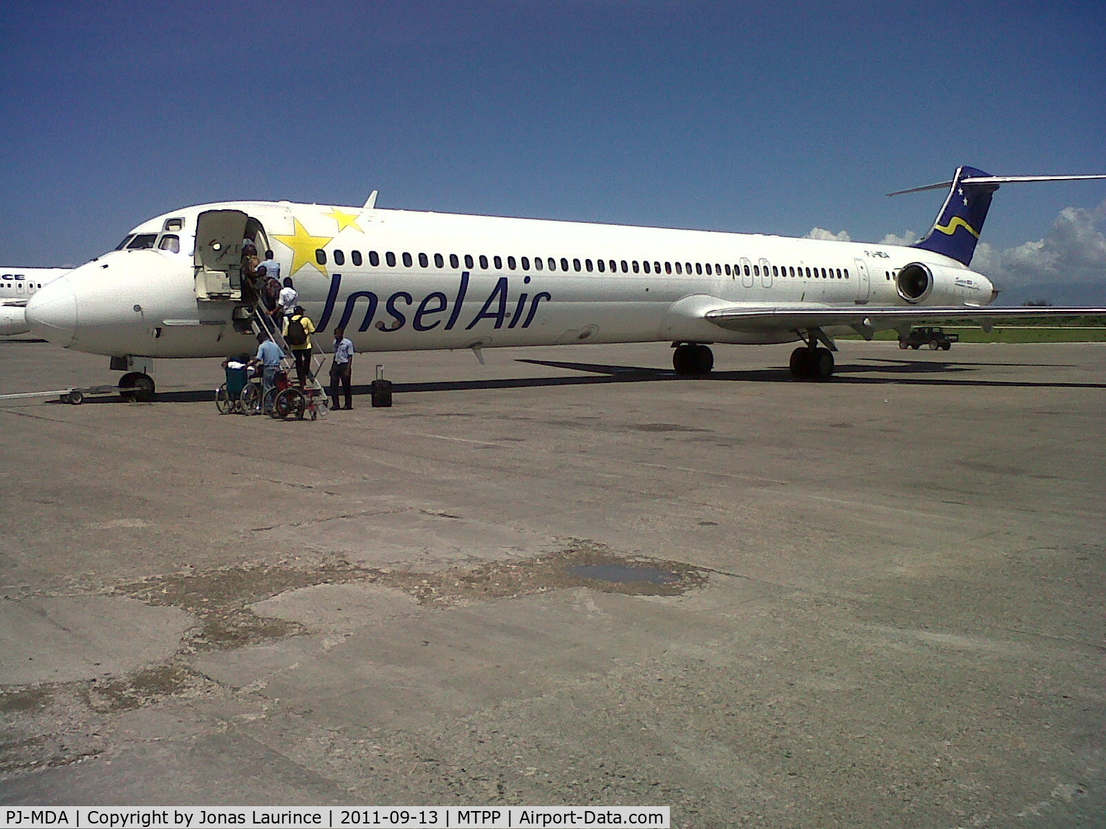 PJ-MDA, 1987 McDonnell Douglas MD-83 (DC-9-83) C/N 49449, Boarding at Insel Air aircraft at the Toussaint Louverture International Airport of Port-au-Prince (Direction Miami international Airport MIA)