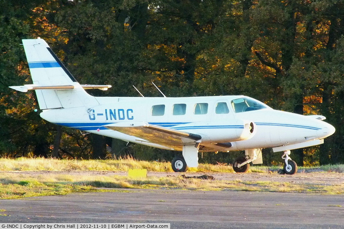 G-INDC, 1982 Cessna T303 Crusader C/N T303-00122, parked on the far side of the airfield minus both its engines