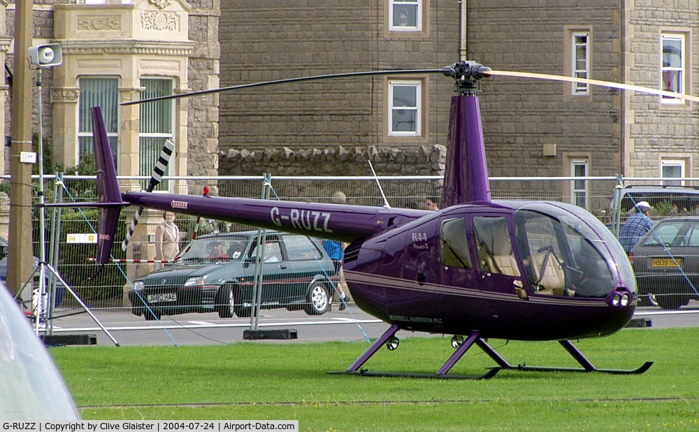 G-RUZZ, 2003 Robinson R44 Raven II C/N 10082, Originally owned to, Heli Air Ltd in May 2003 and currently with, Russell Harrison plc since September 2003. Photo taken in Weston-super-Mare sea-front.