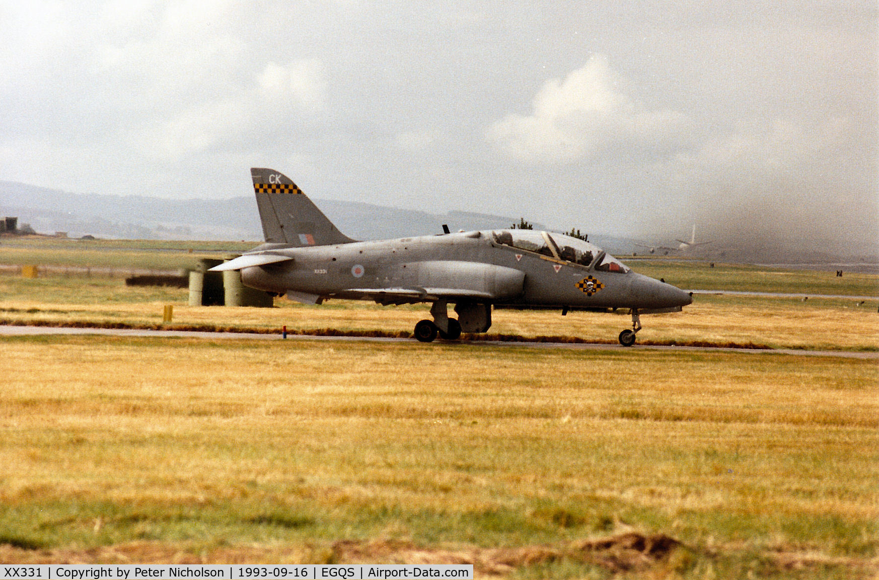 XX331, 1980 Hawker Siddeley Hawk T.1A C/N 177/312155, Hawk T.1A of 100 Squadron at RAF Leeming waiting for clearance to join Runway 23 at RAF Lossiemouth in September 1993 on an Exercise Solid Stance mission .