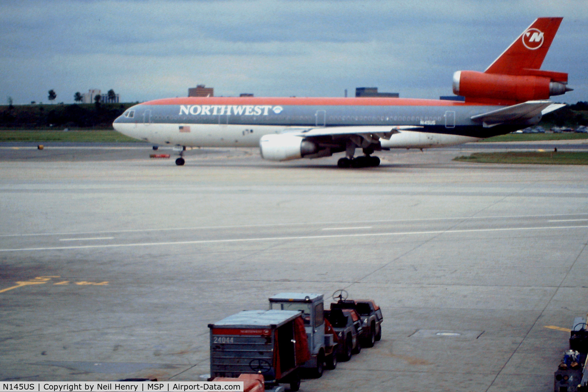 N145US, 1973 Douglas DC-10-40 C/N 46754, scanned from original slide - taken at MSP, from inside terminal - early September 1993