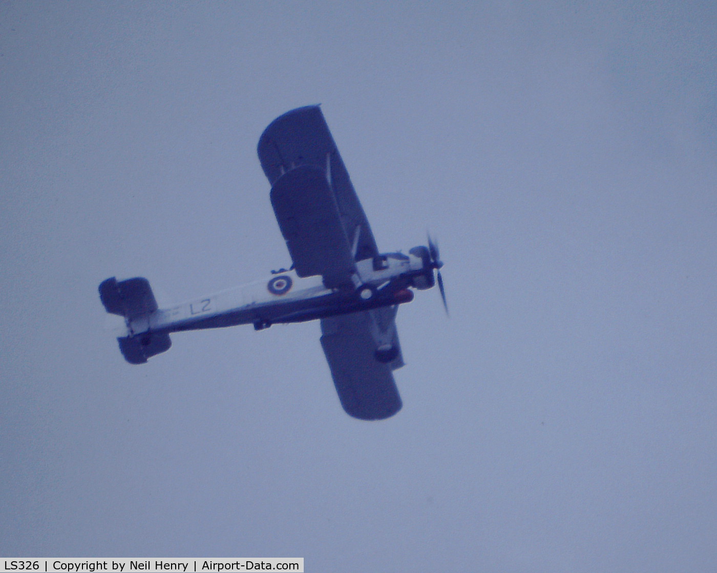 LS326, 1943 Fairey Swordfish Mk.II C/N Not found LS326, Scanned from original slide- taken 1989 flying over the 'Tall Ships Race' in the River Thames at Woolwick, UK 0n a very dull day with drizzly rain.
