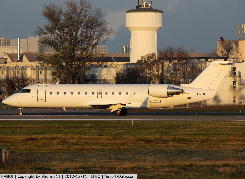 F-GRJI, 1996 Canadair CRJ-100ER (CL-600-2B19) C/N 7147, Ready for take off rwy 32R in all white c/s...