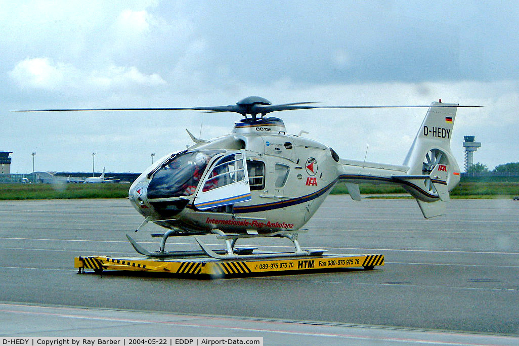 D-HEDY, 1998 Eurocopter EC-135T-1 C/N 0087, Eurocopter EC.135T1 [0087] (IFA Internationale Flug Ambulanz) Leipzig-Halle~D 22/05/2004. Taken through coach window in the rain.