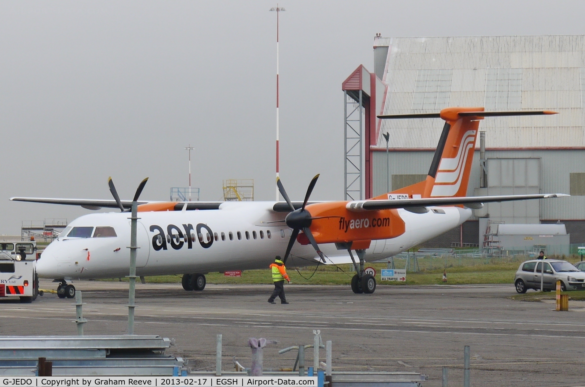 G-JEDO, 2003 De Havilland Canada DHC-8-402Q Dash 8 C/N 4079, Fresh out of the paint shop on a misty day.