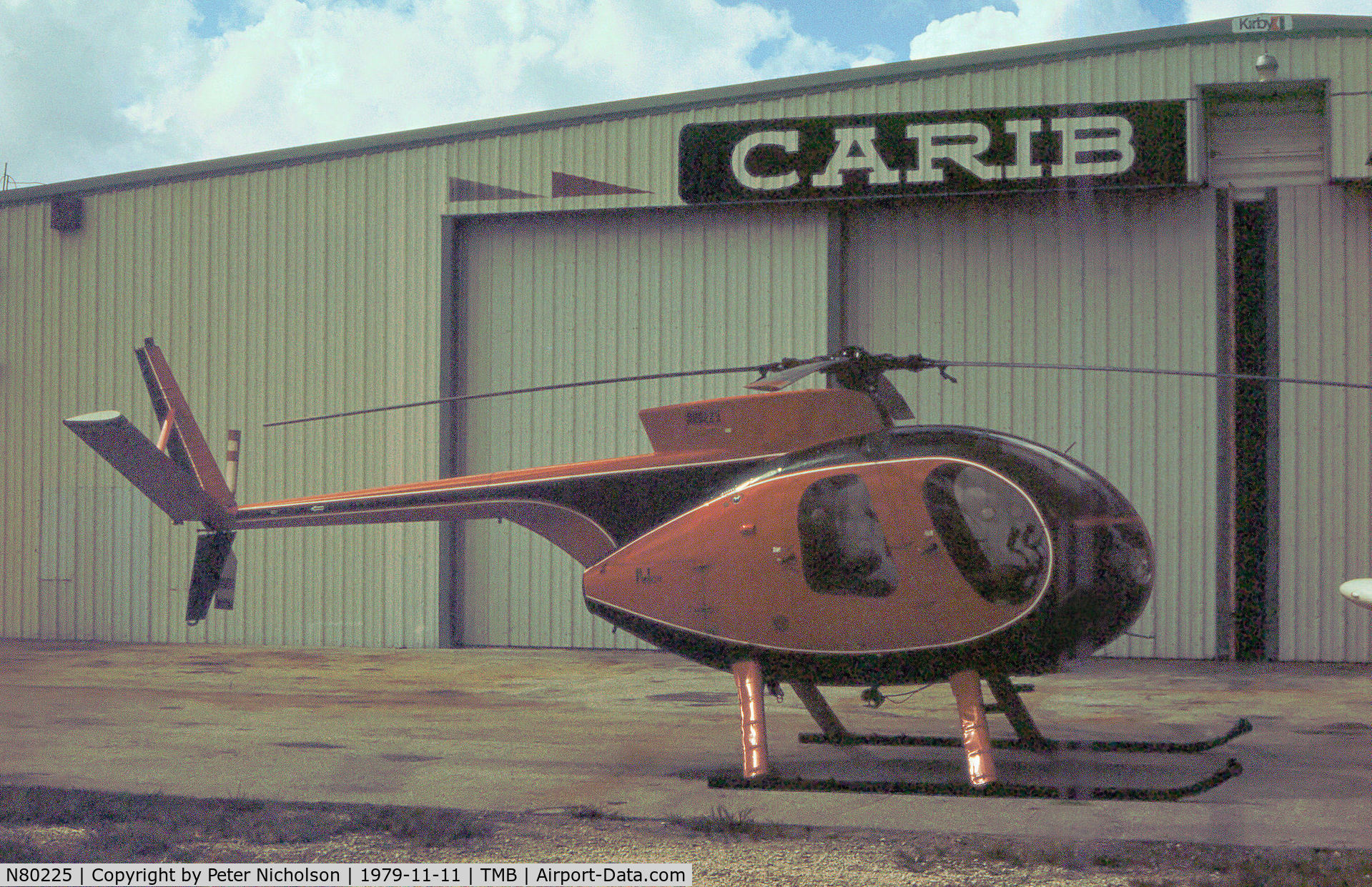 N80225, Hughes 369HS C/N 860857S, Hughes 369HS as seen at New Tamiami in November 1979.