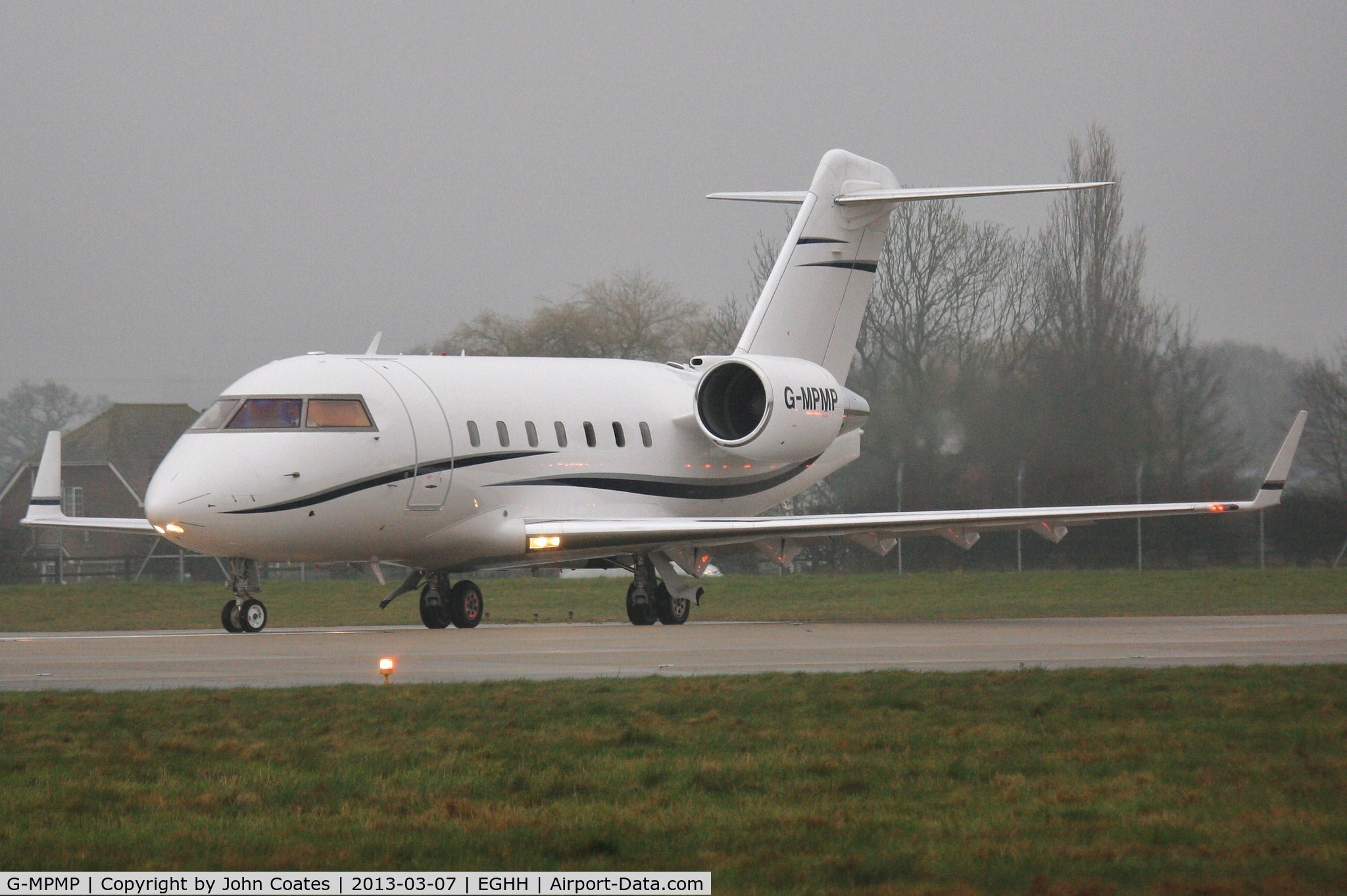 G-MPMP, 2001 Bombardier Challenger 604 (CL-600-2B16) C/N 5528, Interesting light reflections in the mist and drizzle.