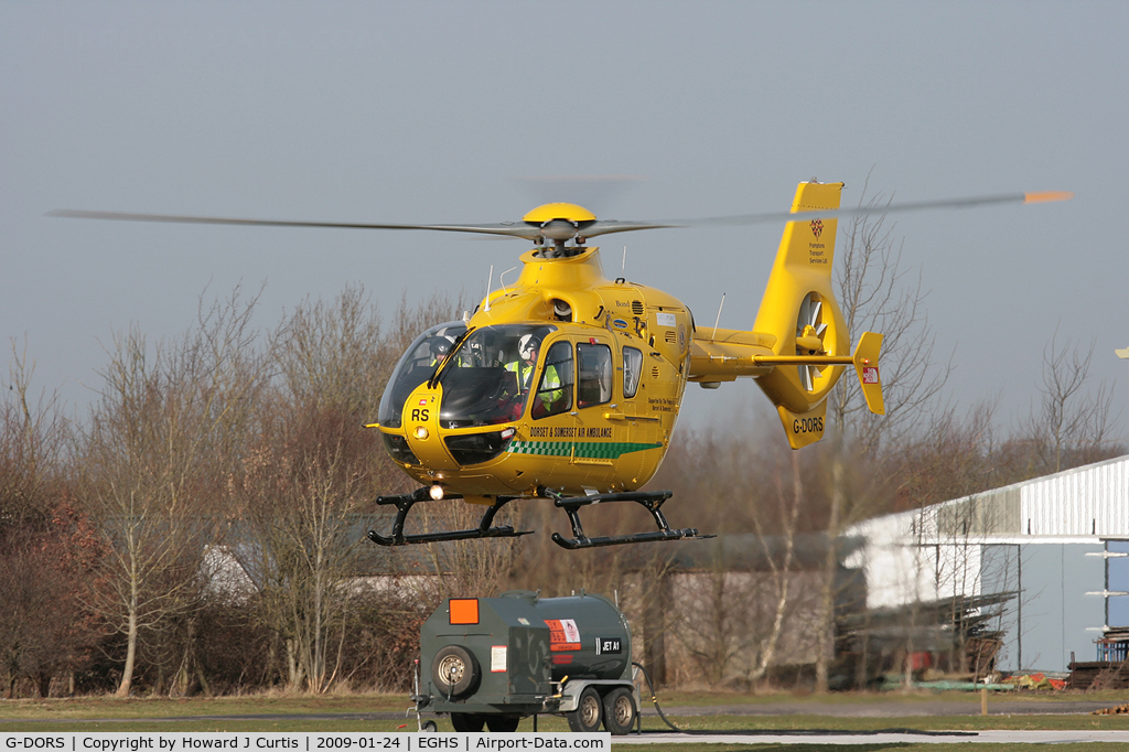G-DORS, 2006 Eurocopter EC-135T-2+ C/N 0517, Dorset & Somerset Air Ambulance, lifting off from its base.